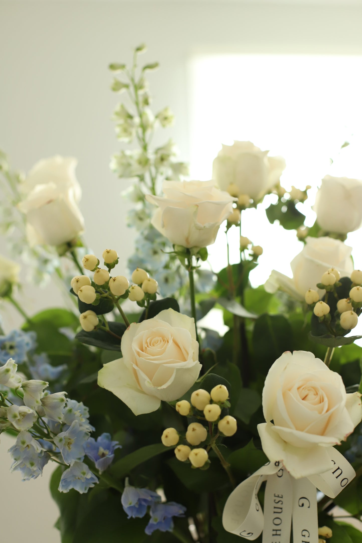 Deluxe Creamy White and Blue bouquet in a vase - Chicagoland's Premier Florist